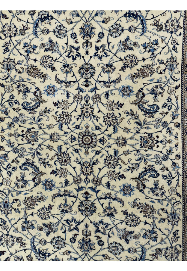 Close-up of the central floral design on the 8'2 x 11'6 Persian Nain rug.