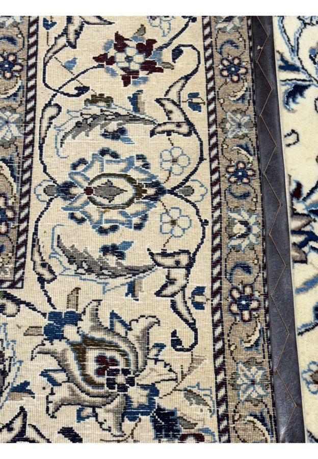Backside of 8'2 x 11'6 Persian Nain rug showing the density, craftmentship and real handmade art.