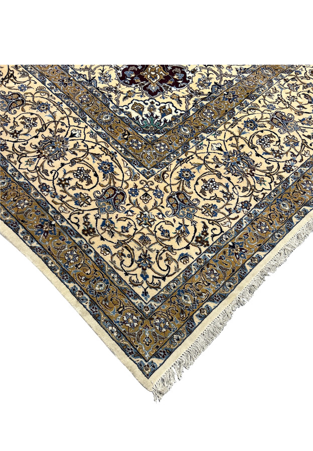 Corner edge of the 16' x 16' Persian Nain rug, revealing hand-knotted craftsmanship.