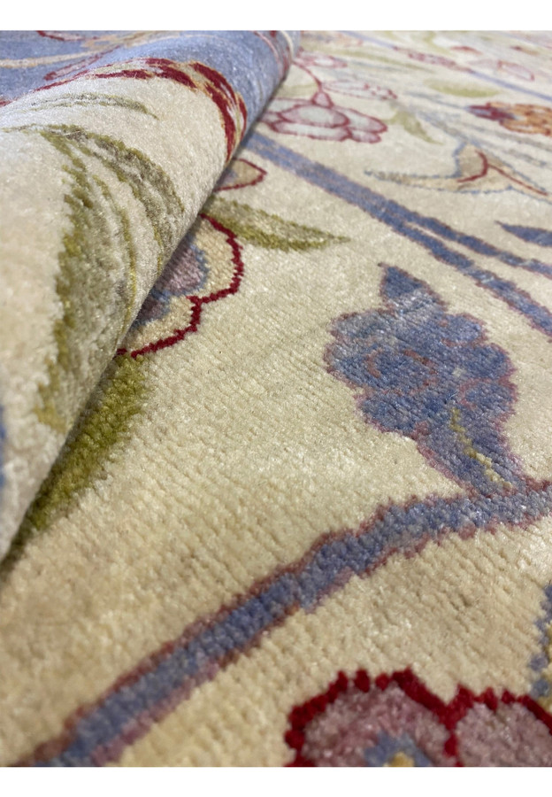 Rolled view of the 12 x 16 Ziglar Rug highlighting texture and thickness.