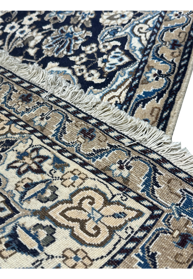 Backside view of the 3'1 x 5 Persian Nain Rug showing cotton foundation.