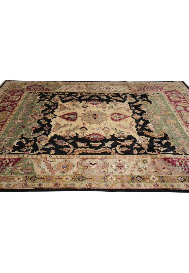 Side perspective of 8.5 x 11.6 Oushak rug featuring antique-inspired design with burgundy, green, and black wool accents.