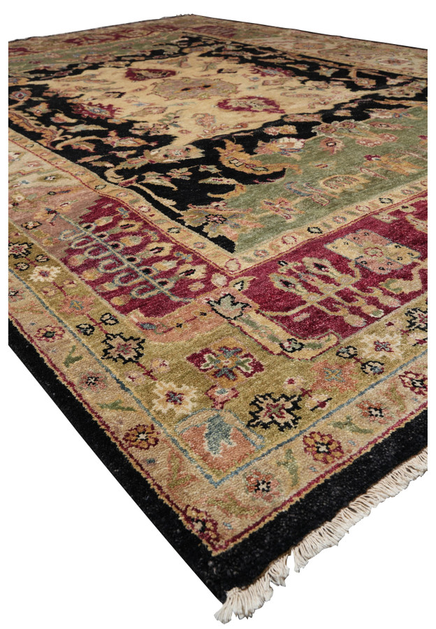 Angled perspective of large Oushak rug highlighting symmetrical antique-inspired field
