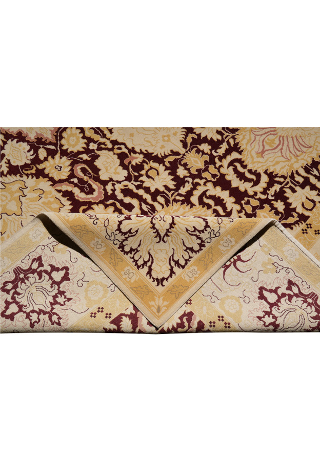 Folded view of large Modern Nepali rug showing flexibility, texture, and handcrafted details