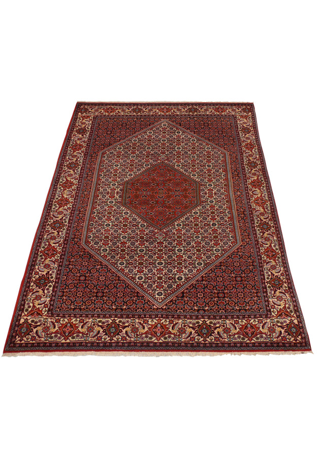 Angled perspective showing dense weave and medallion layout on Bijar rug.