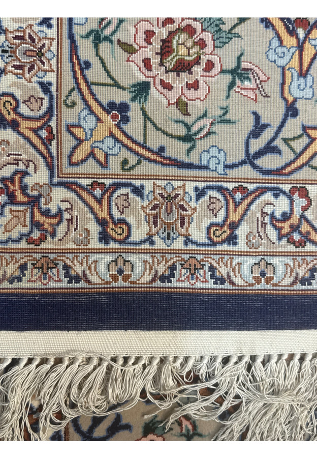 Back view of Persian Isfahan rug showing high knot density and clarity of intricate floral design