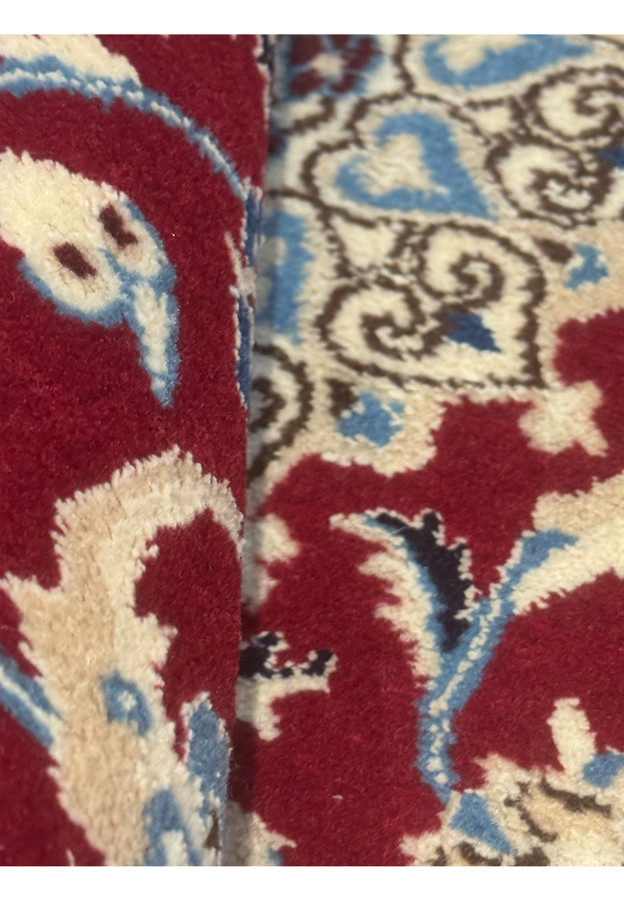 Weaving close-up showing fine motifs and knot quality
