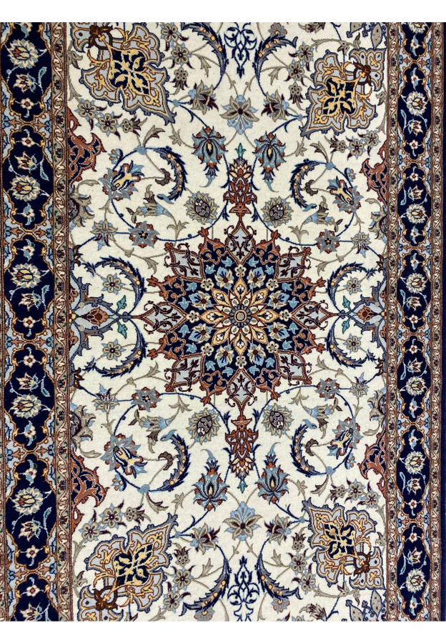 Detailed view of ivory field with scrolling vines and blue, rust, and taupe floral motifs on Persian Isfahan runner.