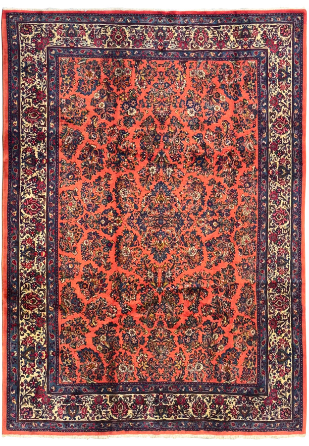 8'5 x 11'3 Persian Sarough rug with burnt coral red field, navy and ivory floral borders, hand-knotted wool, traditional all-over floral design.