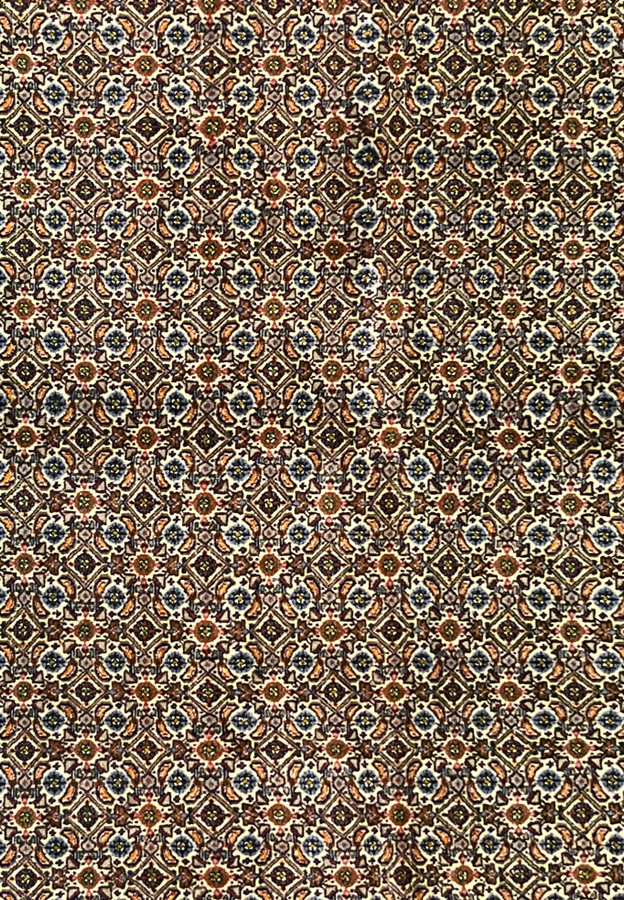 Close-up of rug’s midfield with repeating diamond rosettes and intricate Herati details.