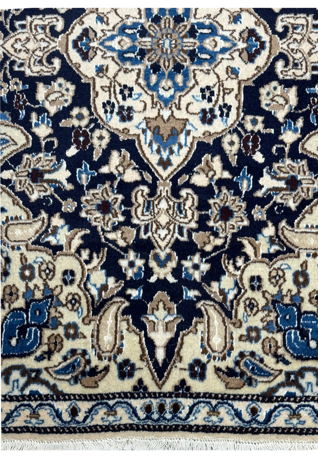 Lower border of 3 x 4'8 Navy Blue Nain Persian Rug showing ivory and navy motifs