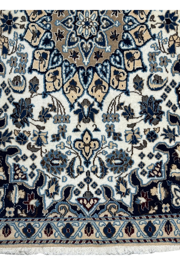 Lower edge detail of 2'9 x 4'10" Ivory Nain Persian Rug with border blossoms.