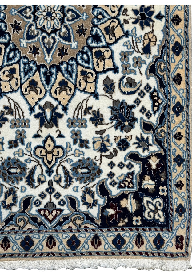 Border detail of 2'9 x 4'10" Ivory Nain Persian Rug with navy ground, ivory blossoms, and scrolling vines.