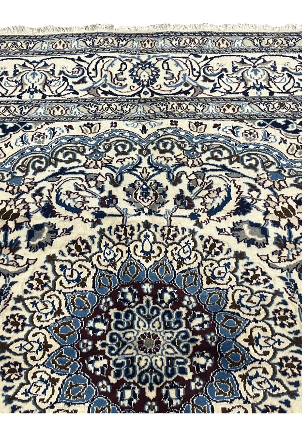 Upper edge and midfield of Square Persian Nain Rug, showcasing silk floral detailing