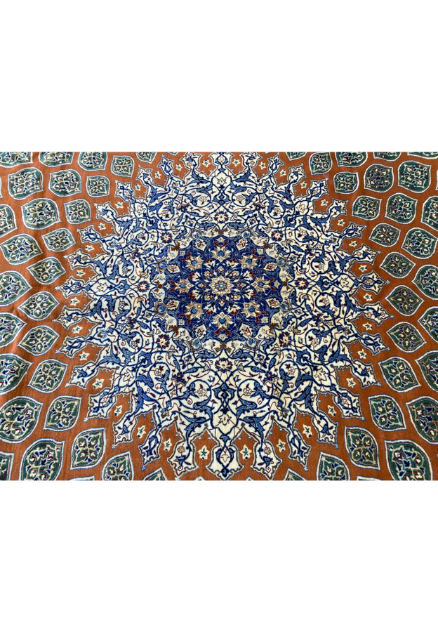 Macro photograph of the Persian Nain 6La medallion showing precision knotting, silk shimmer, and layered floral geometry in deep navy, burgundy, and ivory shades crafted by hand.