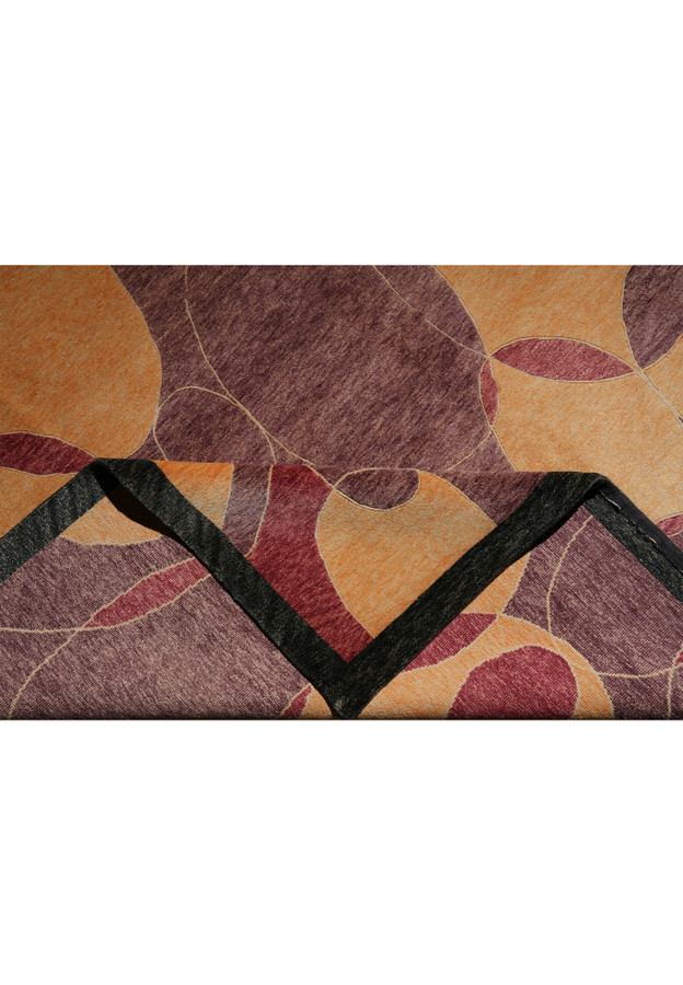 Folded view showing both the pile and the backside of the rug, illustrating its tight weave, precise hand-knotting, and the uniform coloration typical of premium Tibetan craftsmanship.