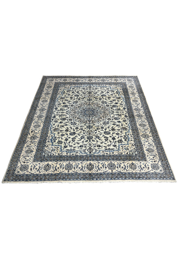 10' x 13'2 Persian Nain 9LA Rug laid flat to display ivory and blue floral pattern with central medallion and layered borders.