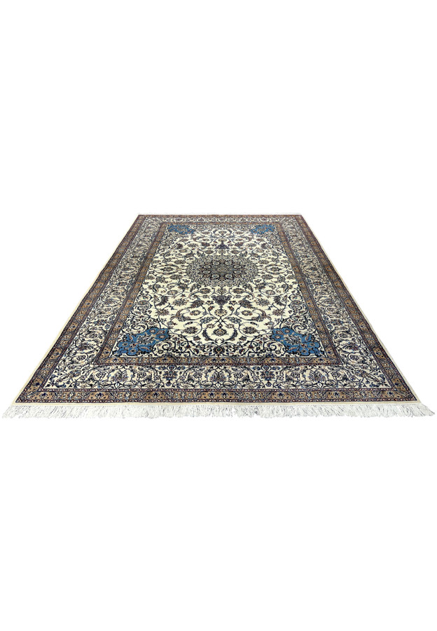 Hand-knotted Persian Nain 4 LA Habibian rug laid flat, highlighting ivory wool background, navy blue details, tan floral border, and silk accents.