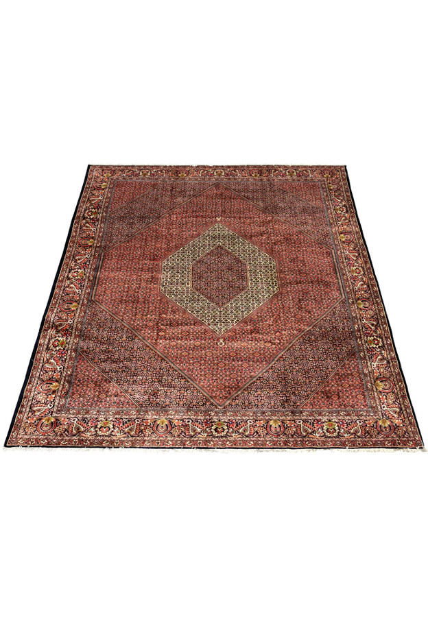 Angled view showing the geometric medallion and detailed Herati field of the Bijar Persian Iron Rug.