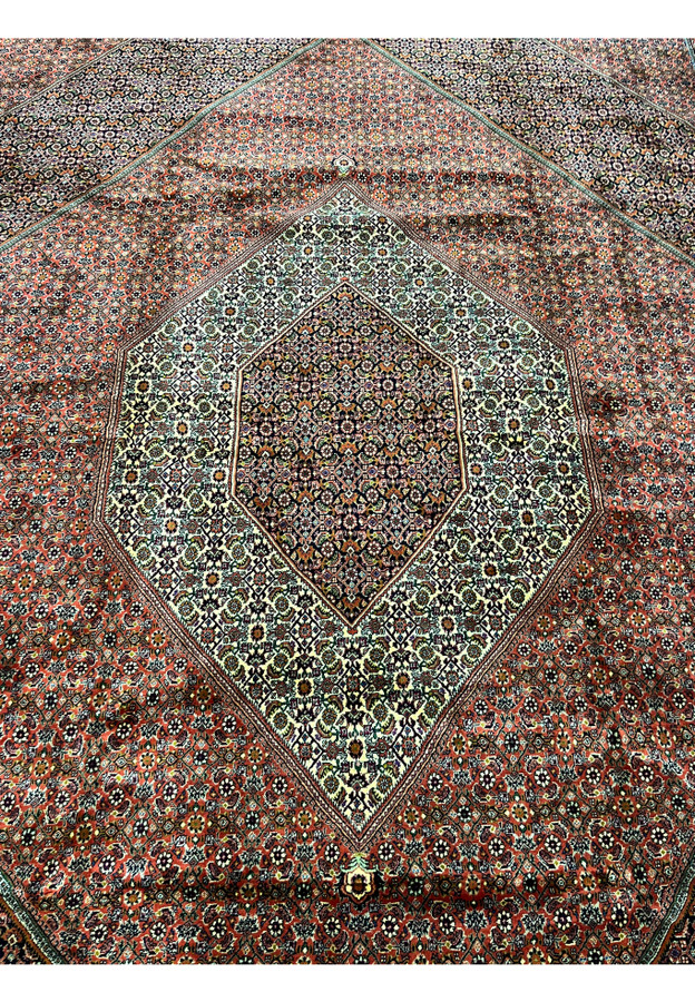 Full central medallion of the Bijar Persian Iron Rug with cream and navy floral latticework.