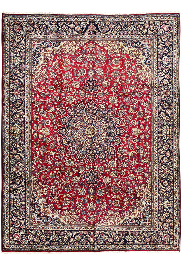 9'10 x 13'1 Persian Isfahan rug full view showing ruby red field, navy borders, floral motifs, and detailed central medallion