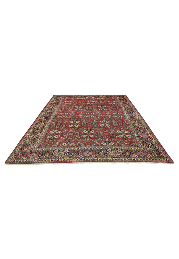 Laid down Bijar iron rug with deep red base, repeating ivory floral lattice, navy scrollwork, and decorative border