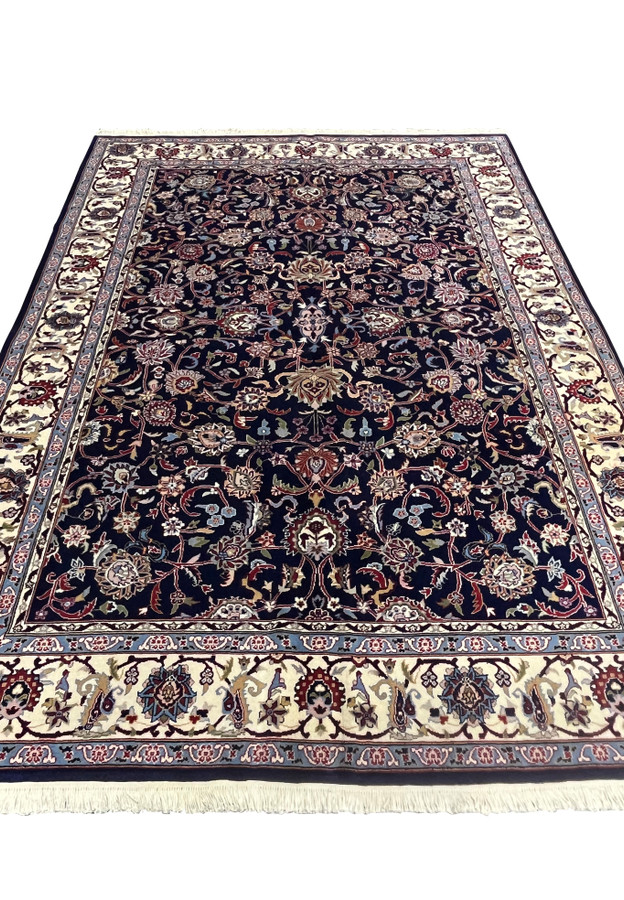 Top view of Persian Sarough rug showing symmetrical allover floral composition