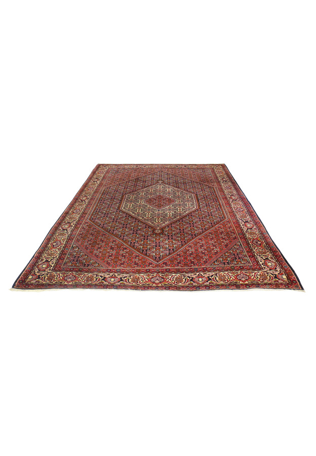 Handwoven Persian Bijar rug laid flat highlighting deep red field and border structure