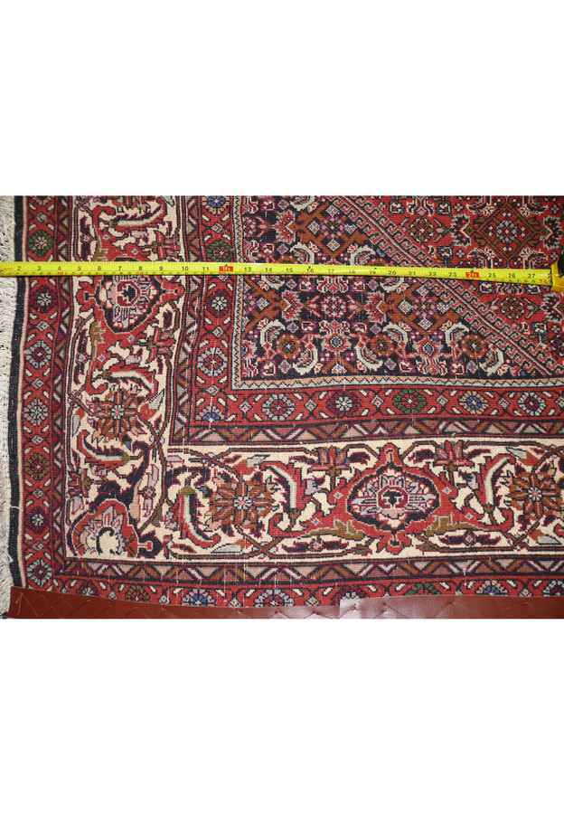 Backside of Persian Bijar iron rug revealing tight knot structure and heavy wool foundation