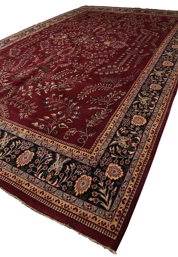 Angled perspective highlighting scale and presence of large Sarough rug