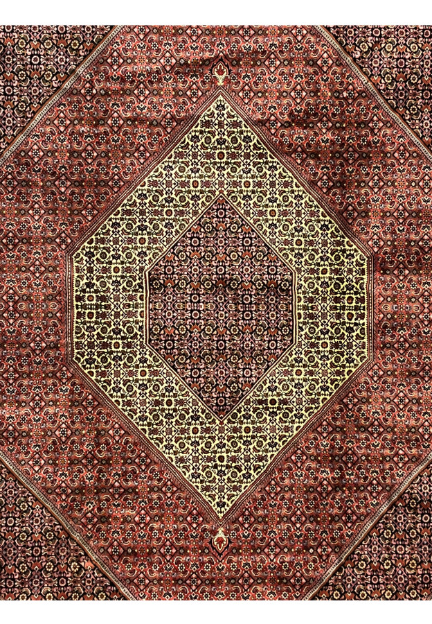 Close view of the ivory and red central diamond medallion in a hand knotted Persian Bijar iron rug