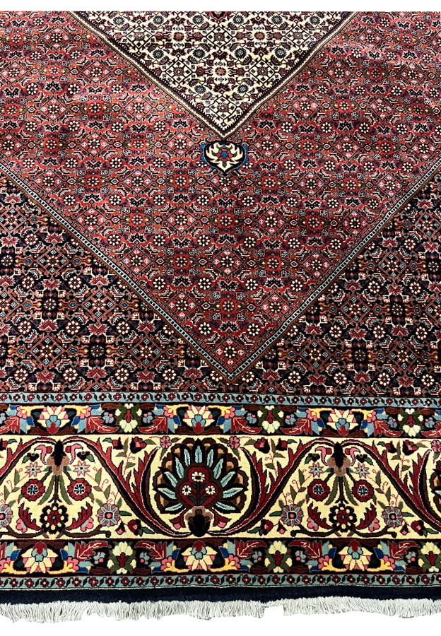 Lower border detail with floral motifs and crisp outlines in a traditional Persian Bijar iron rug