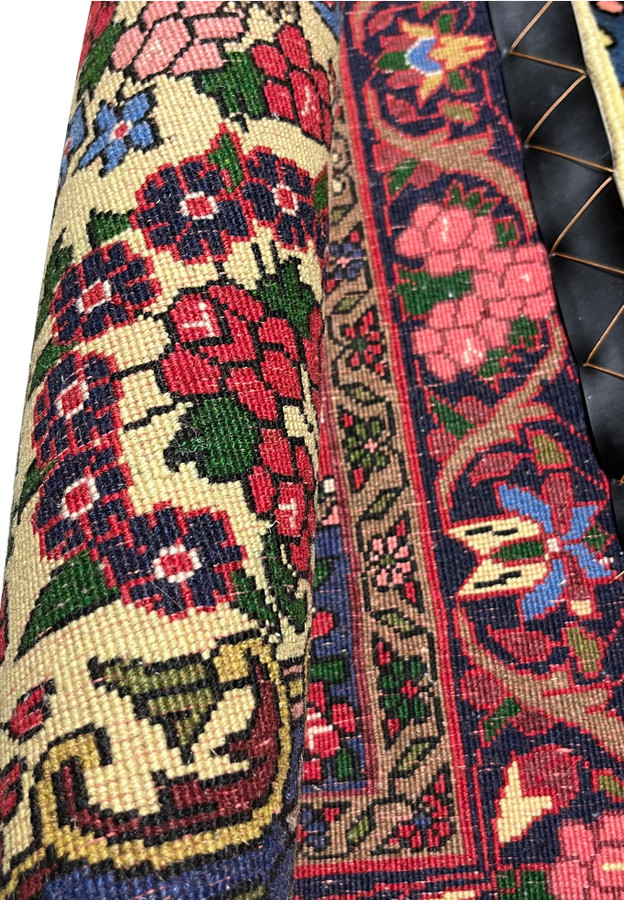 Backside detail of a 3'6 x 4'11" Persian Bijar floral rug showing dense hand-knotted wool construction, golden yellow field tones, deep red borders, and traditional Kurdish craftsmanship