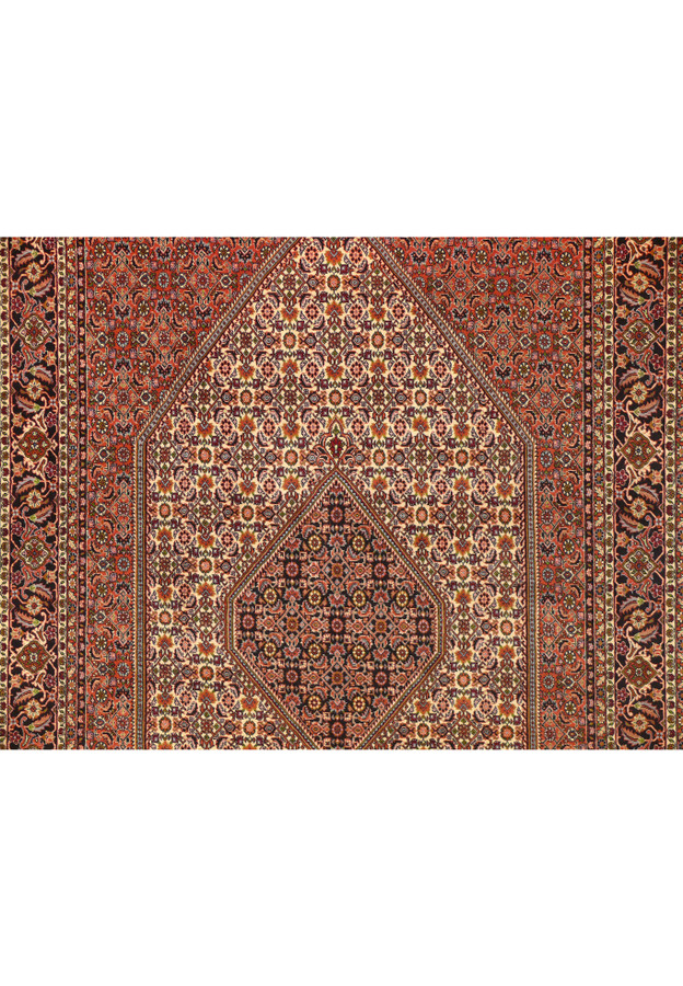Close-up of the central medallion on a 6'5 x 10 Persian Bijar rug showing dense knotting, ivory ground, floral geometry, and deep navy red accents