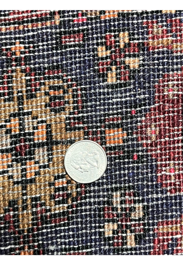 Close view of the backside of a Persian Gholtogh rug with measured knot density, even hand-knotting, visible structure, and durable wool construction