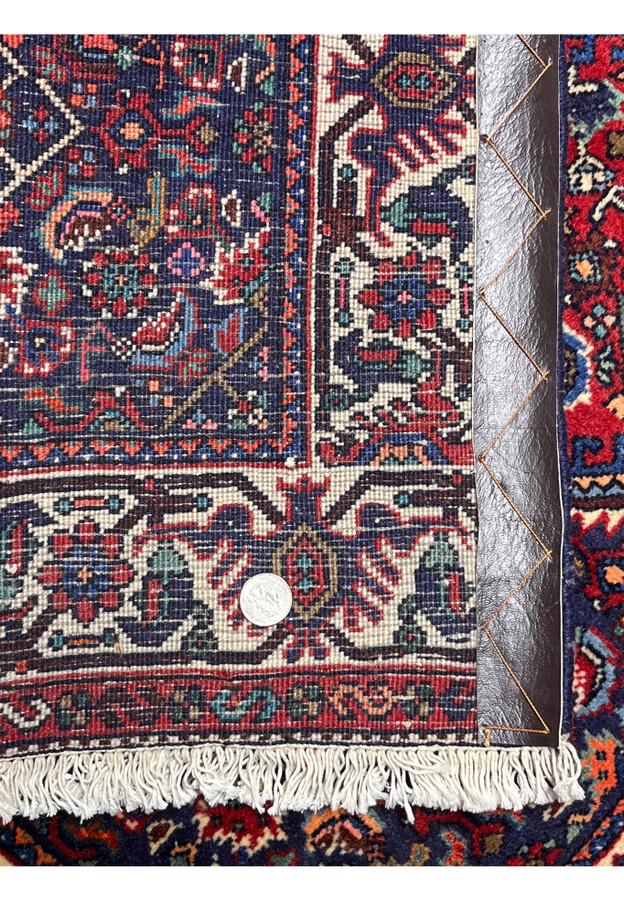 Backside of Persian Gholtogh rug displaying tight hand-knotted construction, balanced wool foundation, and clear geometric pattern definition