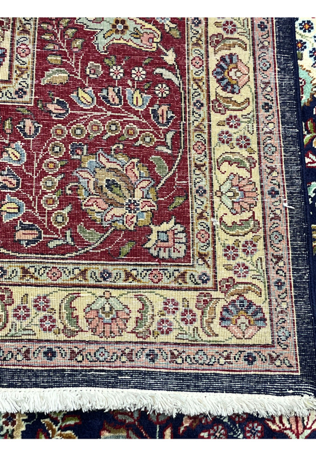 Backside view of an 11'2 x 14'4 Persian Tabriz rug highlighting precise hand-knotting, fine weave structure, and high knot density craftsmanship