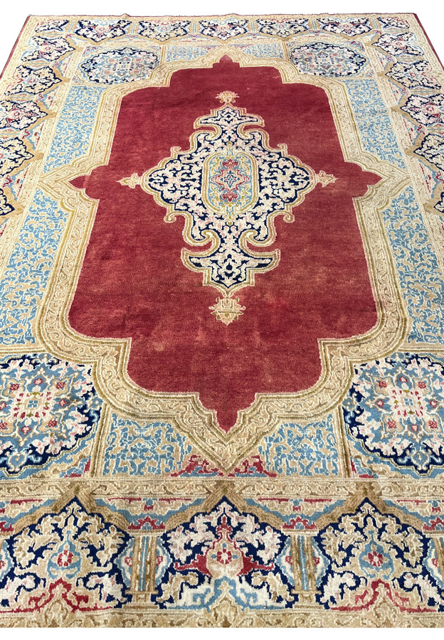 Top view antique Kerman carpet showing full border layout floral panels sky blue compartments ivory frame hand knotted wool