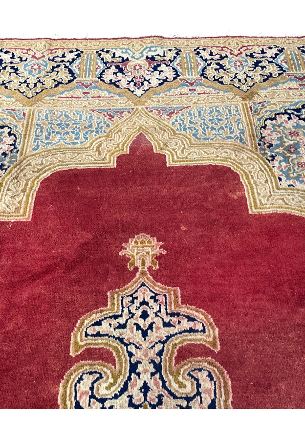 Upper section of Persian Kerman rug with ivory and navy floral border, sky blue cartouches and detailed vine motifs on wool foundation