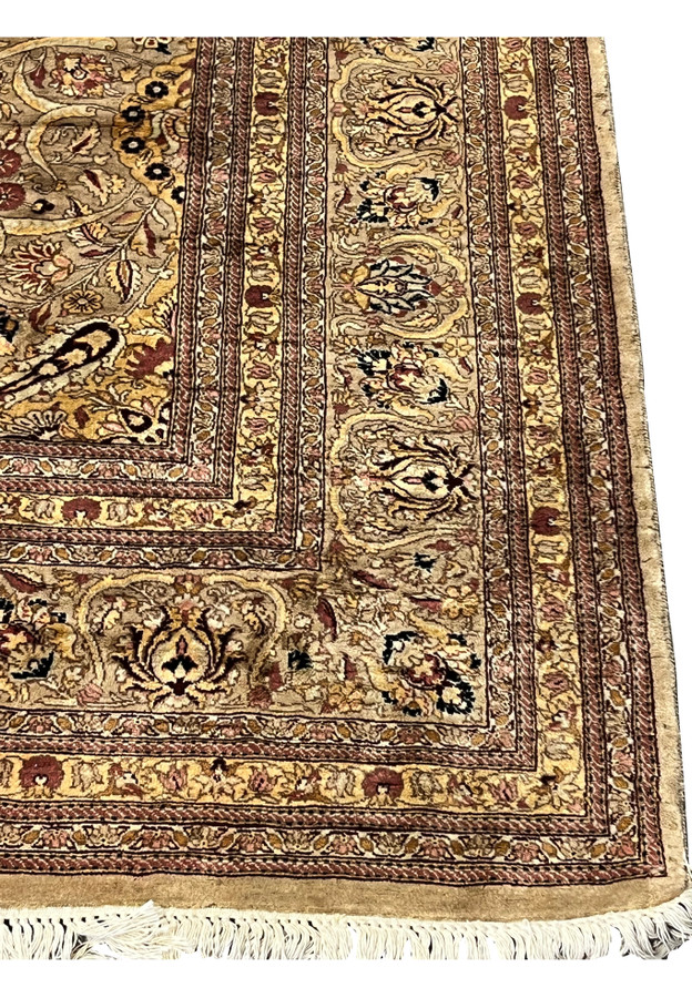 Border detail showing repeating floral cartouches, brown outlines, and antique style guard stripes.