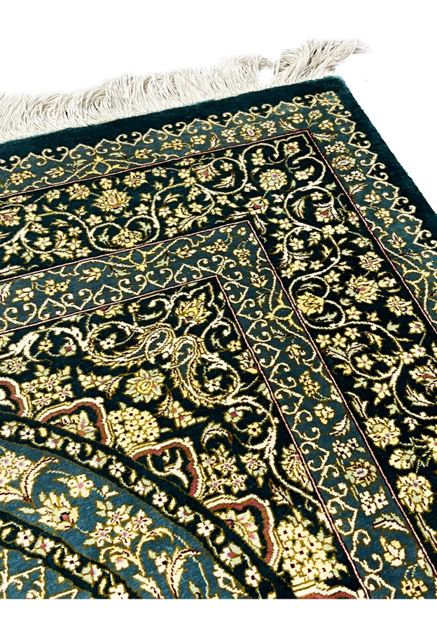 Top edge with silk fringe and floral border detail, showing clean foundation and fine craftsmanship