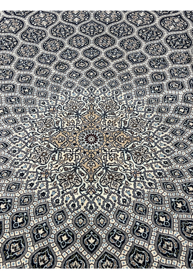 Central dome medallion of Persian Nain Habibian 6 LA rug with silk outlined floral rosettes ivory and camel tones.