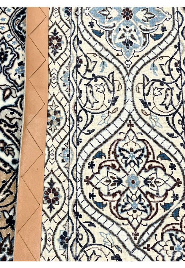 Backside of Persian Nain Habibian 6 LA rug showing fine knot density cotton foundation and detailed dome weave structure.