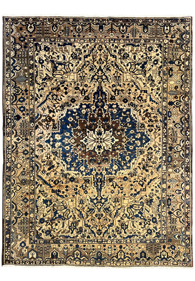 11 x 13'3 vintage geometric Persian Heriz rug in muted navy and ivory featuring bold central medallion and large ivory field with tribal border