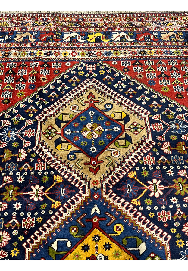 Upper section detail Persian Yalameh 8'7 x 11'7 tribal rug with brick red field accents and geometric medallion alignment