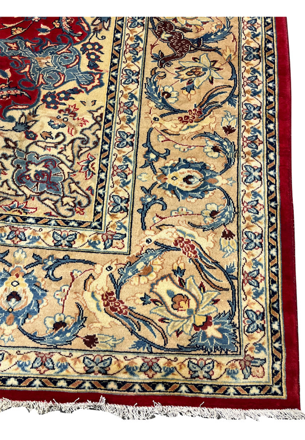 Border detail 10x13 Persian Isfahan wool rug ivory ground deer animal motifs blue floral scrollwork handmade Persia