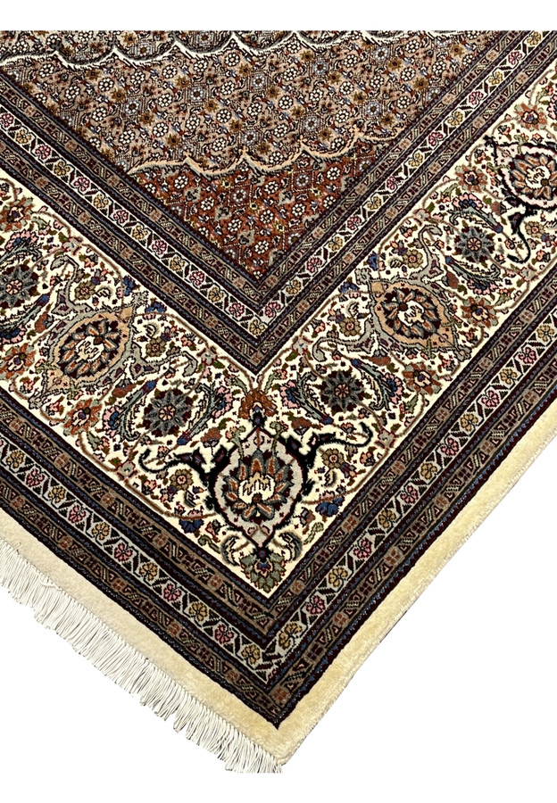 Edge detail Persian Tabriz Mahi 50 Raj wool silk rug hand knotted ivory fringe navy border herati fish pattern field