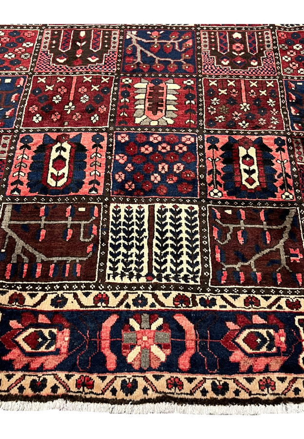 Khane panel detail of 7x10 Persian Bakhtiari wool rug with arched niches and flowering shrubs