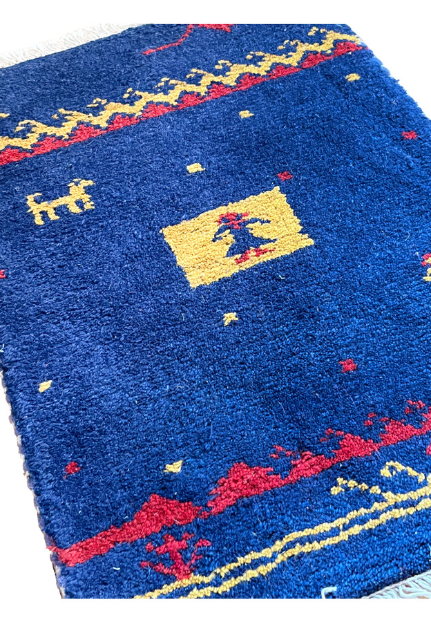 1'3x2 Persian Gabbeh baby rug Poshti cobalt blue tribal pictorial angled view