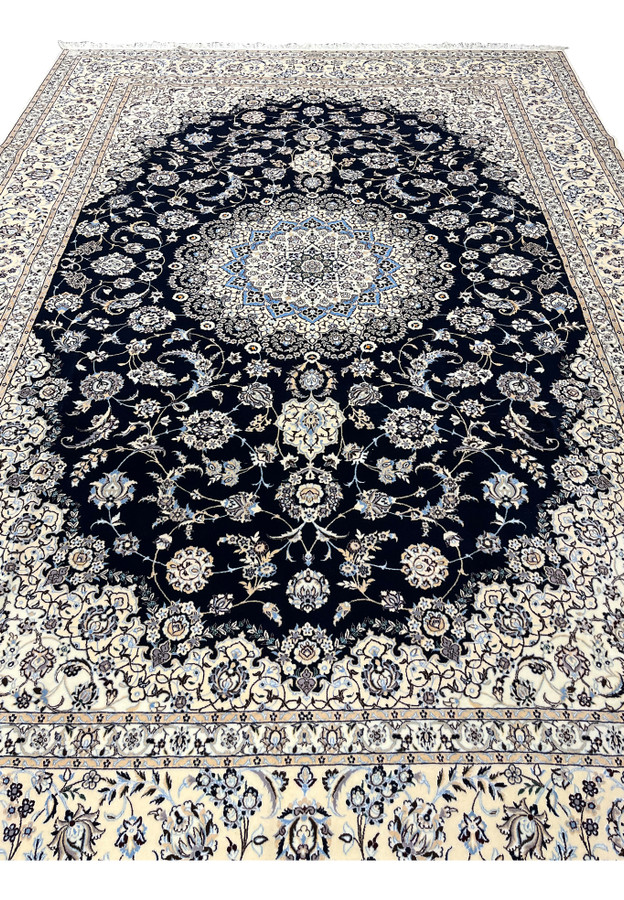 9x12 Persian Nain Habibian 6La rug midfield navy ground ivory medallion silk accents closeup